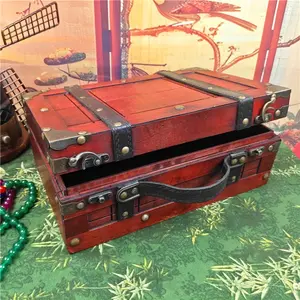 This vintage wooden suitcase is a household storage box with a handle. It is a convenient suitcase for home storage and jewelry storage