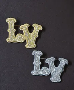 LV Brooch