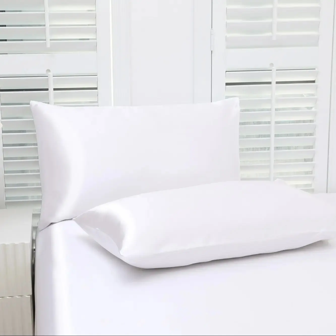 Set of 2 solid-color satin pillowcases, modern and minimalist, soft and comfortable bedding perfect for home bedrooms and dorm rooms. These cool, silky-satin pillowcases are a carefully curated must-have—sold without filling.