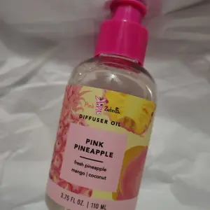 Pink Zebra 3.75 oz Bottle of Diffuser Oil in "Pink Pineapple" smells like: Fresh Pineapple, Mango, & Coconut.