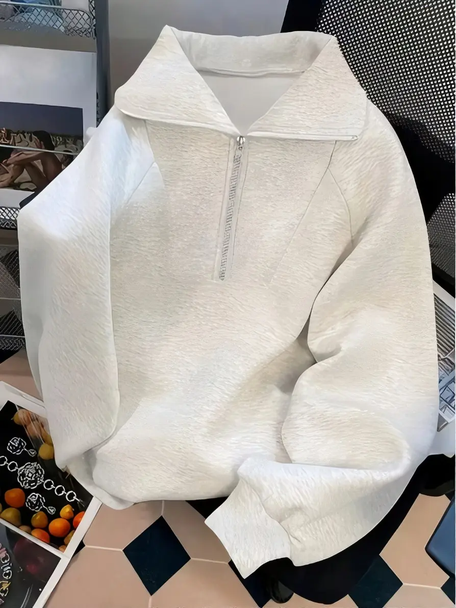 Women's solid-color autumn/winter half-zip polo collar sweatshirt with outdoor-style loose shoulder sleeves, featuring a laid-back, casual, and sporty pullover top design