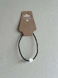 Black Beaded, White Heart Bracelet