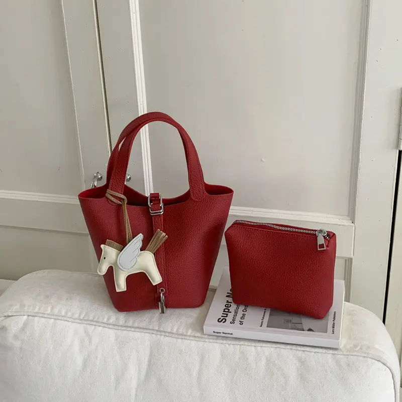 Niche-design women's bucket bag stylish premium-feel crossbody bag with a litchi-grain texture versatile 2026 new arrival suitable for commuting and handheld use