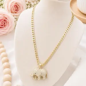 Cuban link chain with long elephant charm 17 inches laminated 14k of high quality.