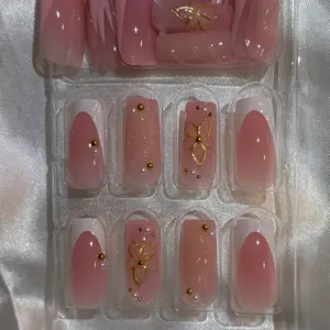 Square French Nails with Gold Butterfly Design and Pearl Accents for Elegant Manicure