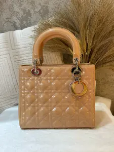 Pre-owned Dior Lady Medium Bag in nude patent leather. Features the iconic cannage quilting 1919