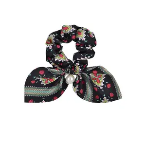 Hold That Thought Bow with Pearl Scrunchie Ponytail Hairstyle