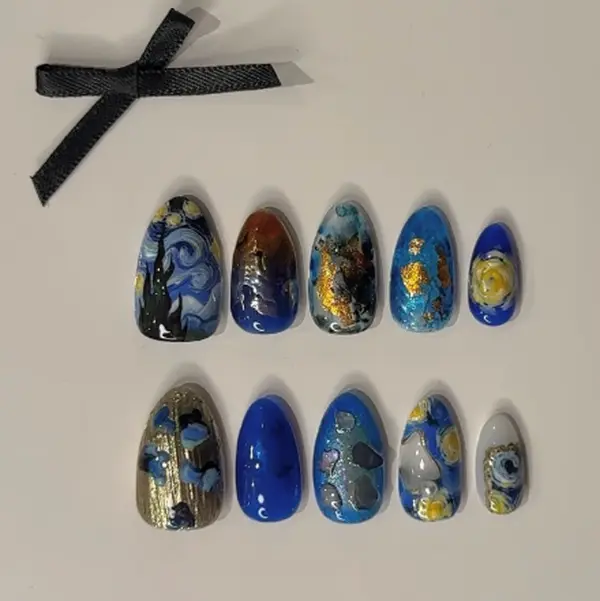 Starry night nail art – inspired by Van Gogh’s masterpiece, featuring swirling blues, golden accents, and textured brush details that capture dreamy artistic elegance.