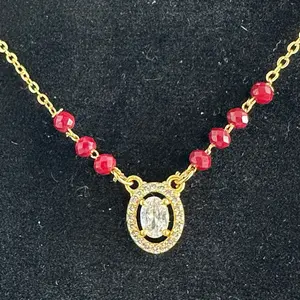 Gold plated daily use Nepali Mangalsutra with red potey and multiple stone work on it.