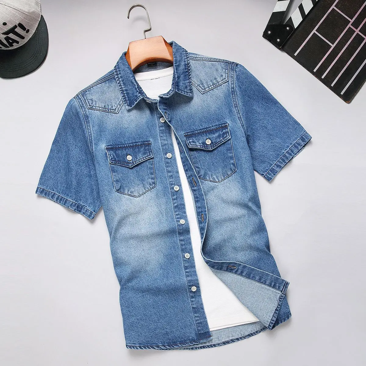 Men's Summer Denim Shirt, Short-Sleeve Casual Button-Down Top for Daily Wear. Crafted with soft, breathable and lightweight denim fabric, this classic short-sleeve shirt features a stylish faded wash, two chest pockets and neat stitching for lasting use.