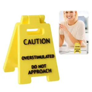 Caution Overstimulated Desk Sign - Yellow Sign with Black Text, Humor Gag Gift for Coworkers, Boss & Employees, Mini Novelty Desk Decor, Desk Signage Decoration