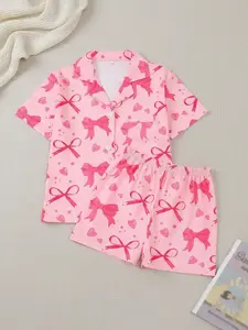 2 pieces of girls' pink bow printed short sleeved shorts and ribbon pajamas set with buttons and elastic waistband suitable for all seasons of casual and comfortable fashionable home wear