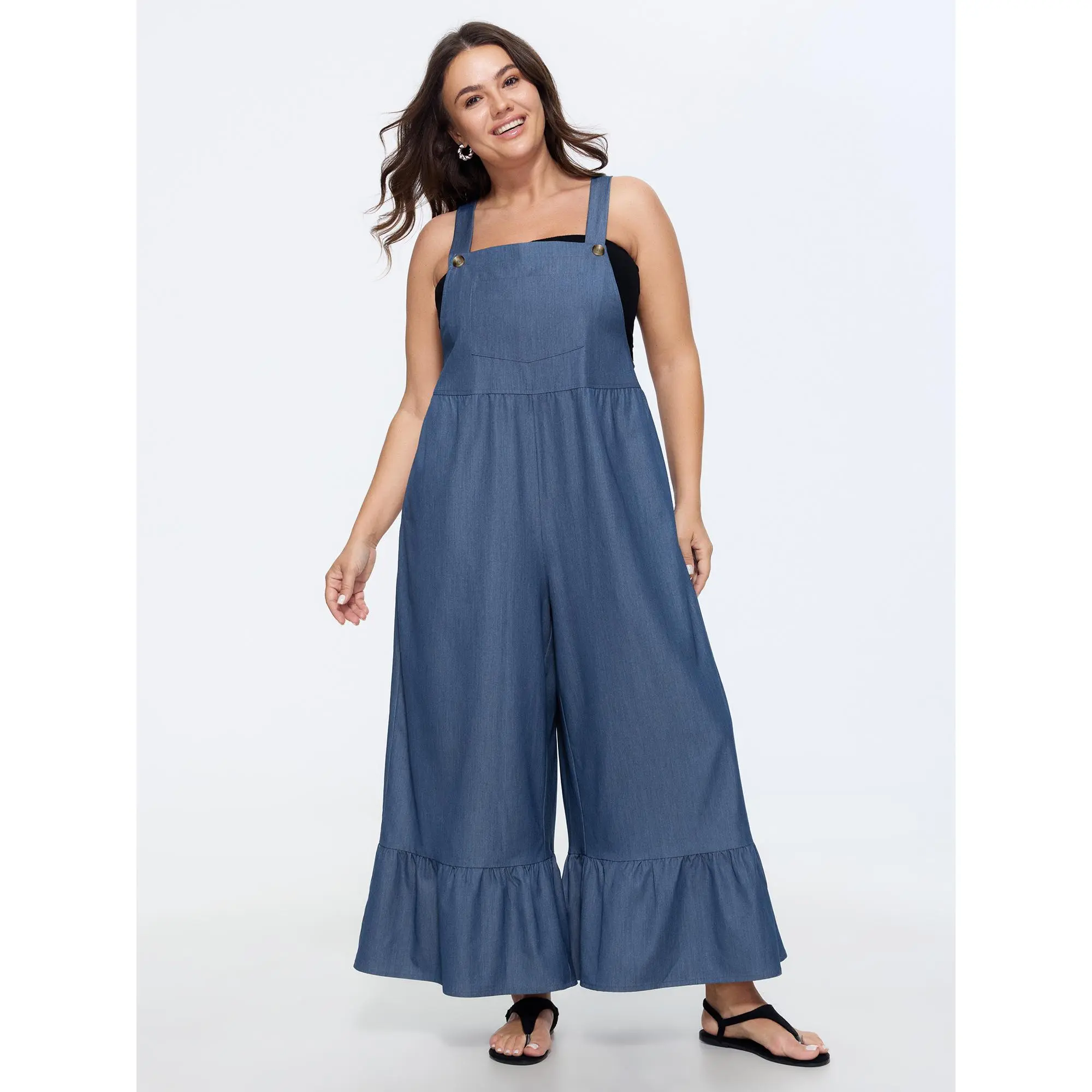 BloomChic Plus Size Leisure Jumpsuit, Solid Faux Denim Overall with a Tiered Ruffle Hem and Pockets, Smooth Polyester Rayon Fabric, Spandex, Garment, Fit, Casual, Overall Jumpsuit, Tiered Hem, Solid Denim, Patched Pockets, Multi-Size, Plus Size Clothes, C