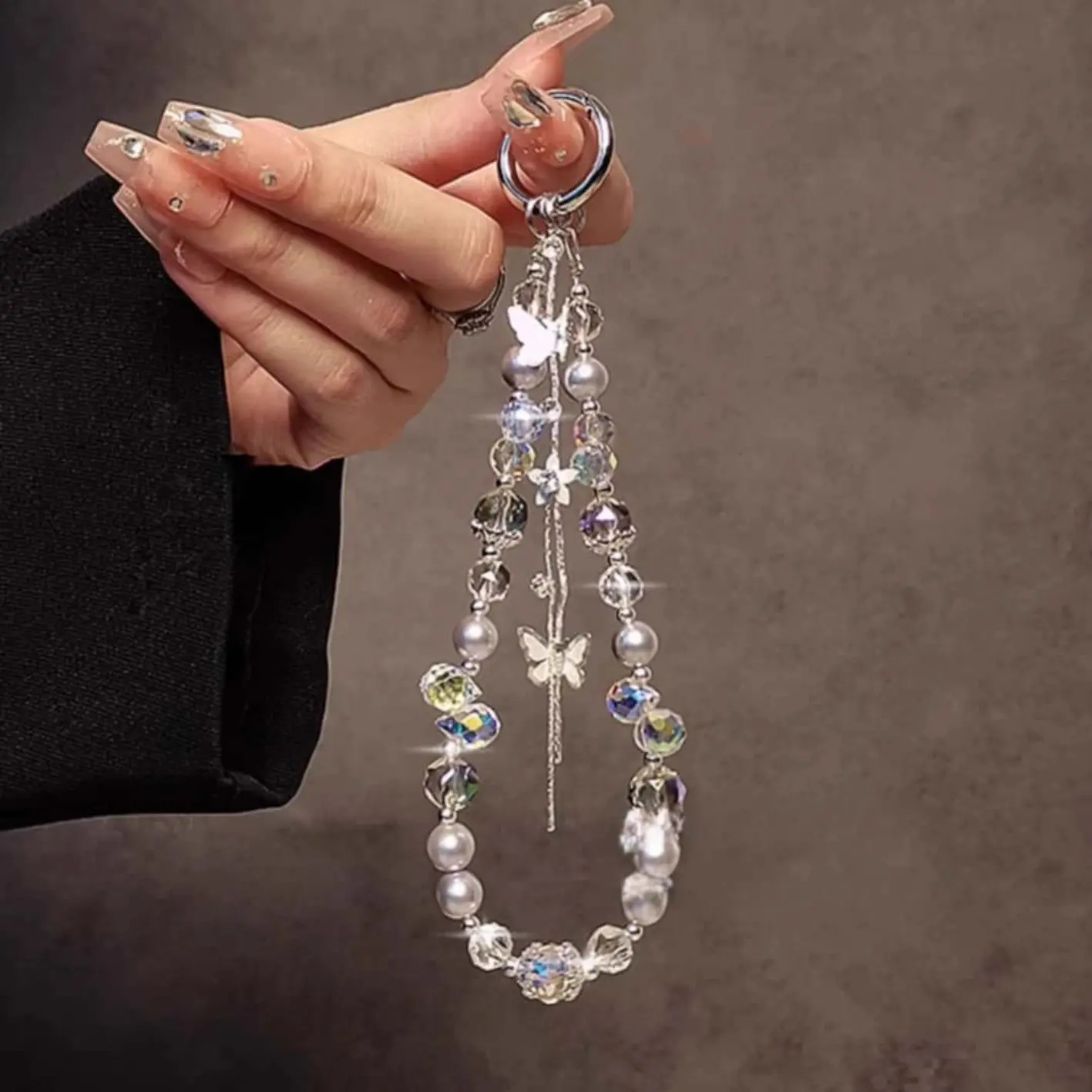 An elegant and luxurious bracelet, adorned with butterfly-shaped crystals and beads, comes with a short strap that can be attached to phone cases, car keys, and bags, Key Charms, Butterfly Keychain, Beaded Keychain, Sparkling Keychain