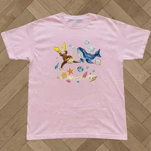 Curious George Ocean Whale Diving T-shirt And Baby Tee | Vintage Marine Life Graphic Shirt, Retro Cartoon Monkey Tee, Aesthetic Coastal Girl Beach Top, Nostalgic Childhood Book Character Clothing, Summer Gift