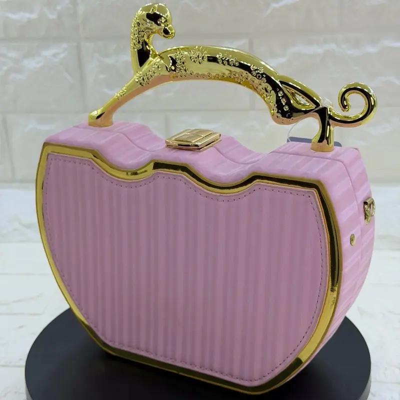 Pink Cheetah Evening Hangbag with Gold Accents and Ribbed Design for Stylish Occasions