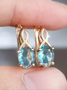 Shiny and luxurious egg-shaped aquamarine synthetic Sparkling Zirconia golden yellow figure-eight deadbeat ladies' ear studs High-end jewellery designed exclusively for ladies Party accessories Elegant Minimalist Earrings