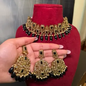 Kundan black and golden choker set with tikka