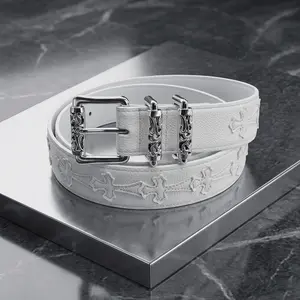 Edgy Y2K Gothic Cross Embossed White Leather Belt, Silver Hardware Punk Streetwear Waist Belt, Adjustable Unisex Pebbled Pattern Roller Belt with Detailed Buckles, Trendy Youth Style Statement Fashion Accessory for Jeans & Street Outfits
