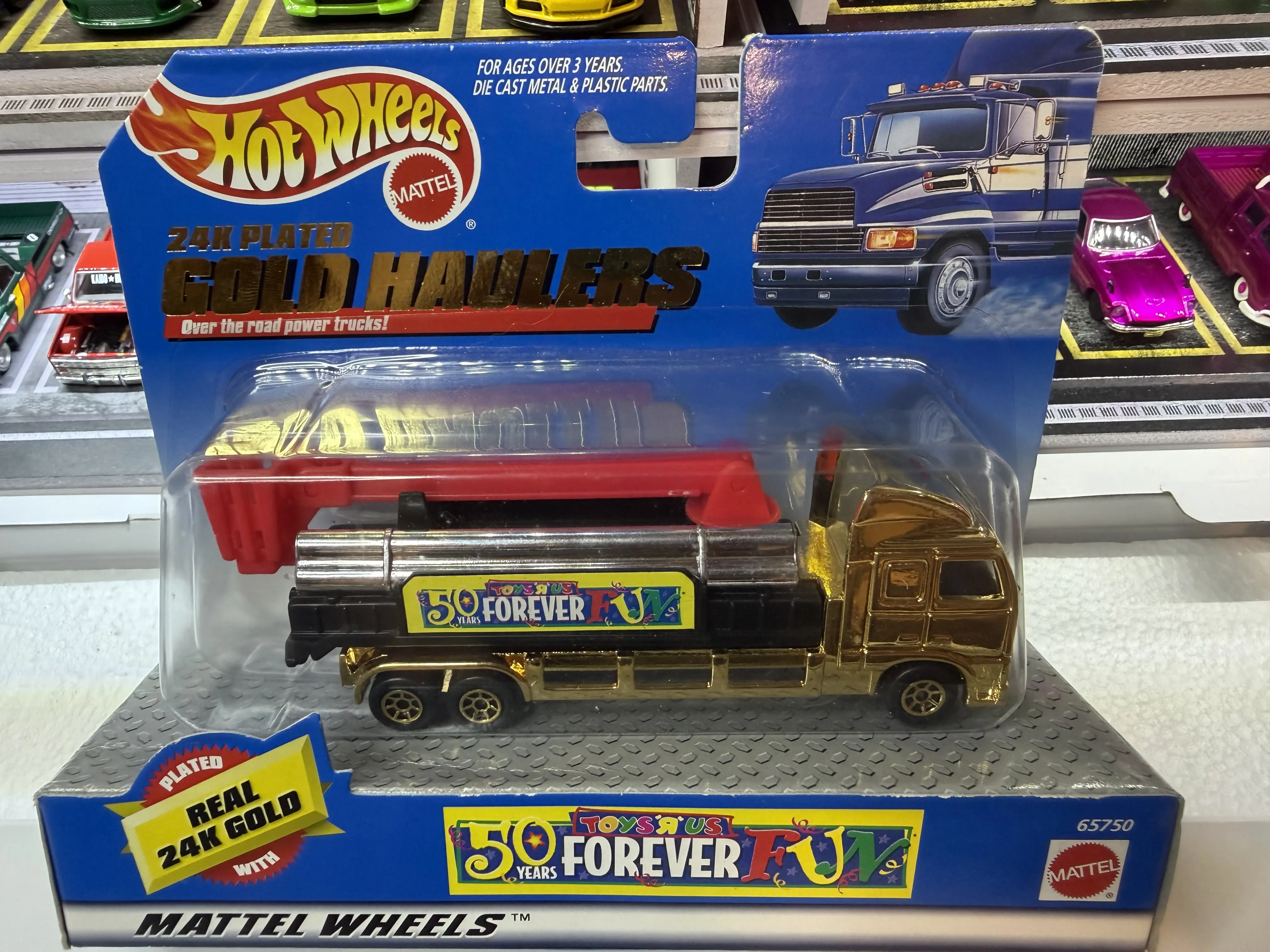 1998 Hot Wheels 24K Plated Gold Haulers die-cast cement truck, produced specifically for the Toys "R" Us 50th anniversary celebration.