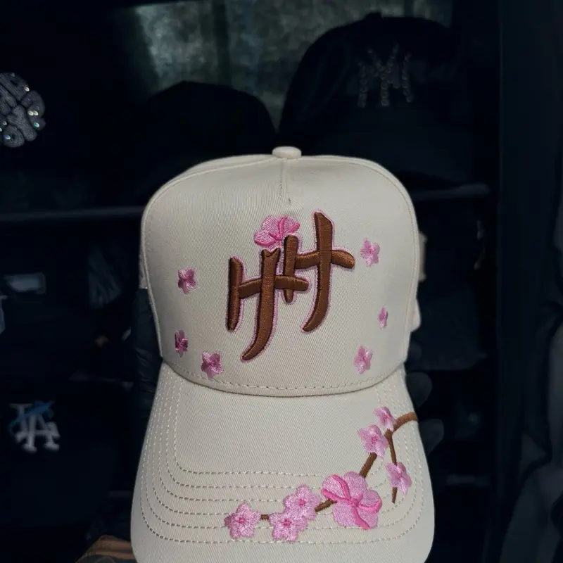 Haven Hats - White Baseball Cap with Pink Floral Embroidery and Brown Logo Design