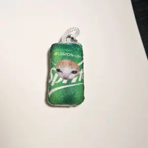 spwite sad cat keychain