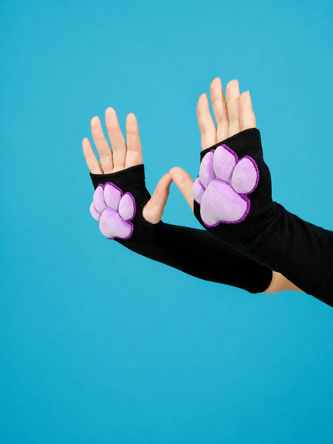 Purple Mochi Stuffed Paw Pad on Black Gloves