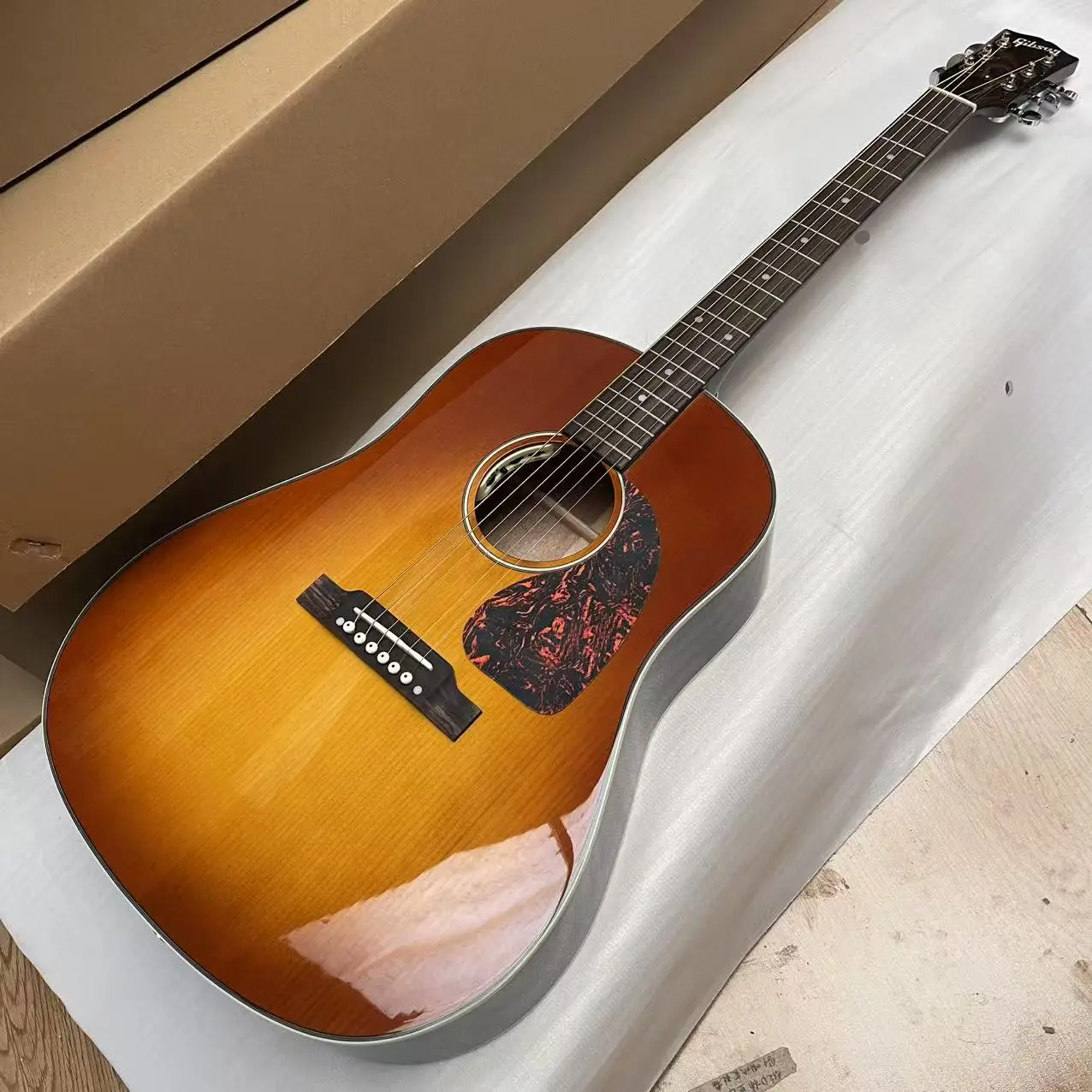 New Gibson J45 Acoustic-Electric Guitar - Solid Spruce Top, Bone Nut, Bone Saddle, Light Cherry Burst Finish New Gibson J45 Acoustic-Electric Guitar - Solid Spruce Top, Bone Nut, Bone Saddle, Light Cherry Burst Finish