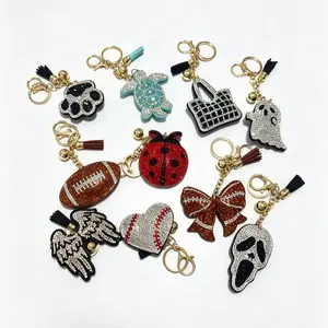 Stylish and cute women’s keychain backpack pendant—small ghost, angel wings, ladybug—ideal holiday gift for a girlfriend and for everyday outfit decoration.