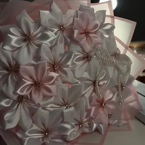 Elegant Pink Satin Flower Bouquet with Pearl Accents and Silver Chain for Special Occasions