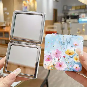 A compact mirror with floral patterns is a portable and foldable square makeup mirror suitable for travel. It is small and lightweight, making it an ideal beauty accessory for women and girls.