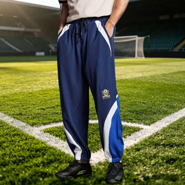 Men’s soccer jogger pants with a drawstring elastic waistband, side pockets with soccer embroidery, breathable quick dry fabric—casual and comfortable for training, running, fitness, and commuting.