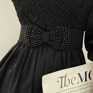 An Elegant Solid Color Elastic Waistband Paired with a Wide Faux Pearl Bow Classic Coat Dress Belt Is Suitable for Women to Wear at Casual Gatherings. belt