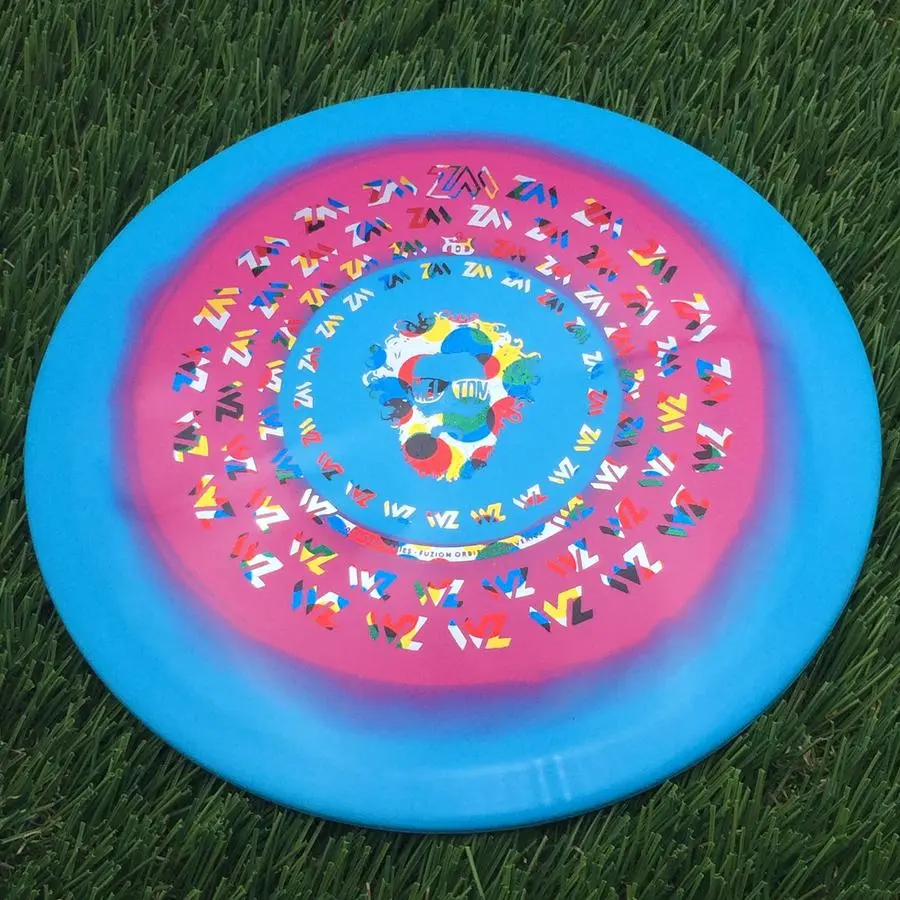Dynamic Discs Fuzion Orbit Eye Maverick with Zach Melton Crazy Hair ZM Spiral Team Series 2023 Stamp - 176.0g - Light Blue