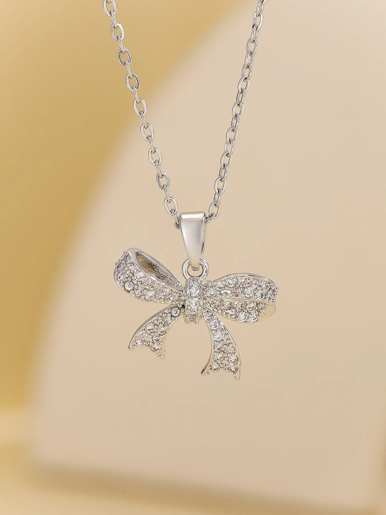 Elegant Women's Charms Necklace with Stainless Steel Chain, Rhinestone Bow Pendant Design, Casual Fashion Jewelry for All Seasons