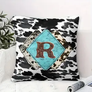Unique Rustic Throw Pillow featuring Digital Print of Black and White Cowhide Pattern, Overlapping Diamond Shapes in Brown and Blue tones, Large Textured 'R' Monogram, Adds Style to Sofa and Bedroom, Soft Inner Cushion Included