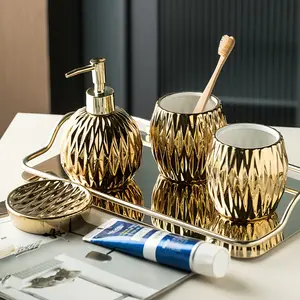 Ceramic bathroom toiletries set comprising a four-piece tabletop ceramic toothbrush holder set, perfect for home decoration and cleaning.