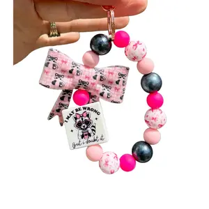 Big Bow Raccoon “I May Be Wrong… But I Doubt It” Wristlet