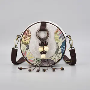 Ethnic-style handmade fabric small round bag for women — versatile tassel shoulder/crossbody bag with bead decoration
