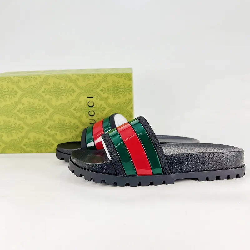 Black red-green stripe colorblock slide sandals featuring iconic thick lug rubber sole, full premium glossy PU leather construction, wide padded strap panels, durable rubber outsole, a trendy must-have for luxury casual summer streetwear lovers