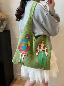 Artistic atmosphere knitted cartoon character pattern tote bag, niche design fashionable personality large capacity shoulder bag, can accommodate tablets, files, suitable for commuting and gatherings.