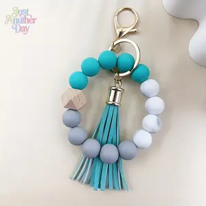 Colorful Silicone Beaded Keychain Wristlet with Food Grade Silicone Beads Polygonal Beech Wood Accent and PU Tassel Dual Elastic Ropes for Easy Wear Stainless Steel Keyring and Lobster Clasp Stylish Boho Accessory Perfect Gift for Women Lightweight and Du