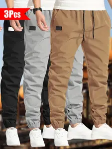 Men’s 3-Pack Casual Jogger Pants – Khaki, Gray & Black – Elastic waistband with drawstring, ribbed cuffs, PU patch detail – Lightweight 100% polyester fabric – Perfect for streetwear, travel, everyday wear – Sizes S–3XL. We recommend choosing one size lar