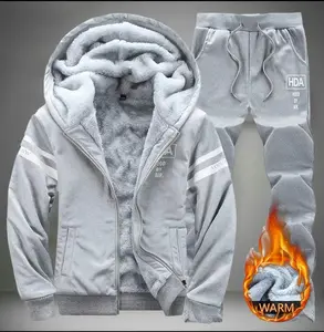 A set of fleece lined hooded sweatsuits, featuring a casual and stylish warm design. The hooded sweater's drawstring adds fashionable flair, while the white stripes on the sleeves and logo enhance the trendy look. Made with fleece for warmth.The pants des