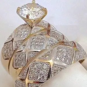 A minimalist three-piece stackable ring set, 14k gold plated with sparkling cubic zirconia stones, for engagement and wedding rings. For women.