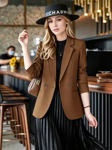Dark brown double breasted suit jacket with three quarter sleeves and waist cinched small suit, versatile commuter women's top