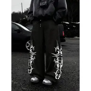 Baggy Black Sweatpants with Tribal Skull Print �C Edgy Streetwear for Y2K & Gothic Vibes! Ultra - comfy, loose fit, perfect for casual looks. Stand out with the bold white tribal skull design. Ideal for TikTok��s streetwear and alternative fashion trends.
