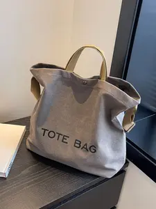 1pcSimple and casual large capacity canvas Soft Commuter tote bag, equipped with letter printed logo, snap closure, dual hand strap and adjustable detachable shoulder strap, suitable for daily commuting, campus travel and leisure life dressing scenes.