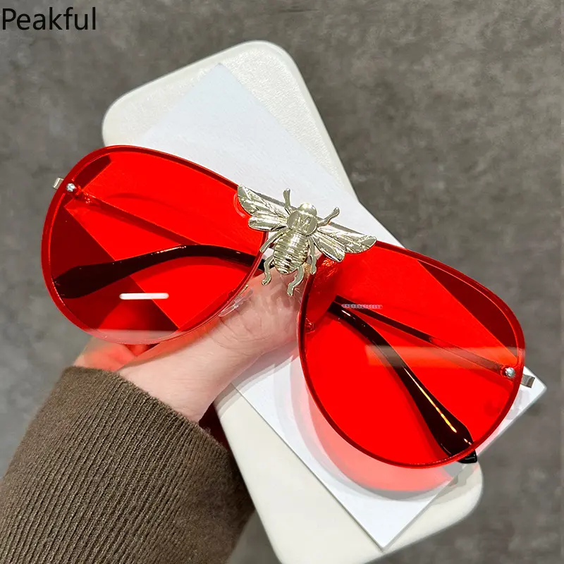 Oversized Red Tinted Bee Sunglasses, Popular Rimless Aviator Style Statement Shades, Elegant 3D Bee Decor Red Eyewear, sleek frameless silhouette & vibrant red lens, great for date nights, weekend gatherings, holiday events and bold daily accessories