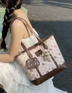 Cross-border e-commerce Niche Design Cute Large-capacity Tote Bag Commuter Student Printed Cartoon Shoulder Bag with Adorable Charm Fashionable Bucket Bag Leather Bag